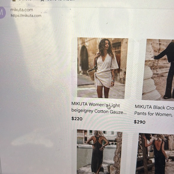 Mikuta black wrap dress sold out online sells for 220 when in stock. - Picture 16 of 16